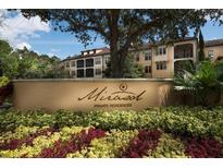 Mira Sol Private Residences entrance with landscaping and signage at 501 Mirasol Cir # 309, Celebration, FL 34747