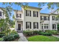 Two-story house with black shutters and lush landscaping at 1136 Lake Baldwin Ln, Orlando, FL 32814