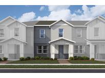 Two story home with gray and white exterior and landscaping at 163 Aulin Ave, Oviedo, FL 32765