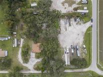 Aerial view of a property with ample space and buildings at 621 Oaklando Dr, Altamonte Springs, FL 32714