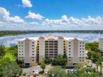 Condominium building with lake view and ample parking at 6312 Buford St # 304, Orlando, FL 32835