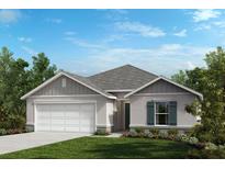 New home with gray and white exterior and landscaping at 2812 Gabion St, Bartow, FL 33830
