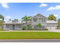 Two-story home with gray siding and three-car garage at 6320 S Sylvan Lake Dr, Sanford, FL 32771