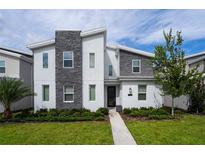 Two-story home with modern gray and white exterior at 4537 Target Blvd, Kissimmee, FL 34746