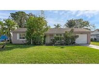 One-story home with a spacious lawn and attached garage at 2319 Continental Blvd, Orlando, FL 32808