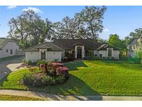 Beautiful home with a well-maintained lawn and landscaping at 216 Shady Oaks Cir, Lake Mary, FL 32746