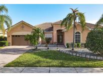 Single-Gathering home with a two-car garage and attractive landscaping at 3623 Weatherfield Dr, Kissimmee, FL 34746