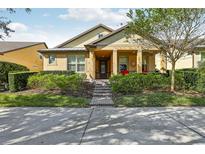 One-story home with yellow siding and a covered porch at 14132 Murcott Blossom Blvd, Winter Garden, FL 34787