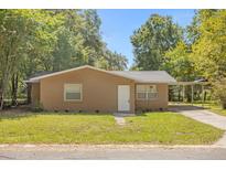 Charming single story home with a carport at 516 Pitt St, Wildwood, FL 34785