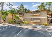 Two-story building with parking and landscaping at 120 Hibiscus Woods Ct # 8D, Deltona, FL 32725