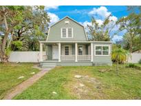 Charming green house with a front porch at 1515 Indiana Ave, Saint Cloud, FL 34769