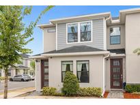 Modern two-story townhome with gray siding at 4715 Terra Esmeralda Dr, Kissimmee, FL 34746