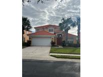 Two-story home with a two-car garage at 238 Carrera Ave, Davenport, FL 33897
