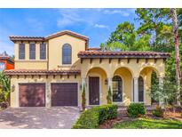 Two-story Mediterranean home with a two car garage at 600 Via Chris Ct, Debary, FL 32713