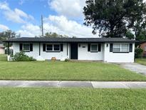Ranch-style home with fresh white paint at 5937 Colchester Dr, Orlando, FL 32812