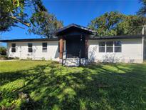 Newly renovated single-story home with a modern facade and spacious lawn at 899 5Th St, Winter Haven, FL 33881