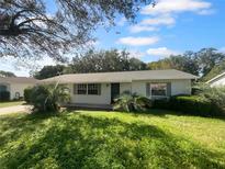 Charming single-story home with a well-manicured lawn at 46 Columbine Trl, Debary, FL 32713