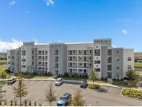 Modern apartment building with ample parking at 3131 Paradox Circle 204 # 204, Kissimmee, FL 34746