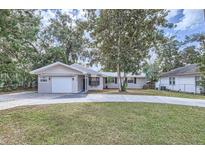 Charming single story home with a landscaped yard at 524 E Church St, Deland, FL 32724