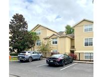 Building exterior with parking lot and landscaping at 413 Summit Ridge Pl # 209, Longwood, FL 32779