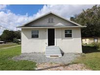 House with front yard, steps leading to the entrance at 828 Willie Mays Pkwy, Orlando, FL 32811