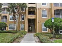 Building exterior with stairs and landscaping at 2484 San Tecla # 303, Orlando, FL 32835