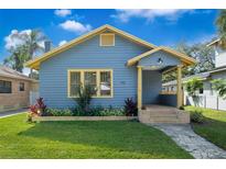 Charming bungalow with light blue siding and yellow trim at 1910 Illinois St, Orlando, FL 32803