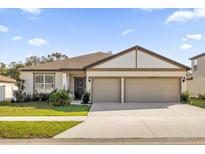 Two-car garage and well maintained landscaping at 1178 Michelangelo Ln, Winter Haven, FL 33884