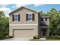 Two story home with neutral siding and two car garage at 4525 Ranunculus St, Lake Hamilton, FL 33851