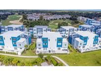 Modern townhouses with private patios and a golf course view at 7740 Sandy Ridge Dr # 218, Reunion, FL 34747