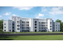 Modern apartment building with light gray facade at 3191 Paradox Cir # 406, Kissimmee, FL 34746