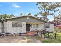 Brick house with gray trim and carport at 447-441 N Lincoln St, Daytona Beach, FL 32114