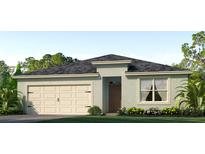 One-story house with a light-colored facade and a two-car garage at 7146 Painted Bunting Way, Saint Cloud, FL 34773