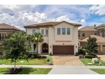 Two-story home with a brown door and three-car garage at 1110 Watson Ct, Reunion, FL 34747