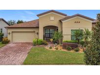 Beautiful home exterior with well-maintained landscaping at 941 Rimini Dr, St Cloud, FL 34771