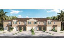 Tan three-story townhome with garages and landscaping at 684 Preston Cove Dr, St Cloud, FL 34771