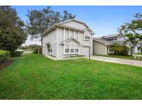 Two-story house with gray siding and landscaped lawn at 1820 Blaine Ter, Winter Park, FL 32792