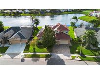 Two-story home with lake view and solar panels at 2626 Raccoon Run Ln, Orlando, FL 32837