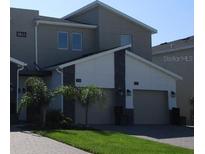 Two-story modern home with two car garage at 8863 Cabot Cliffs Dr # 104, Davenport, FL 33896