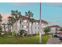 Two story building exterior with palm trees and parking at 4575 S Texas Ave # 109, Orlando, FL 32839