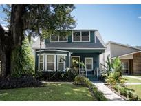 Charming 2-story house with a landscaped yard and walkway at 806 Cypress Ave, Sanford, FL 32771