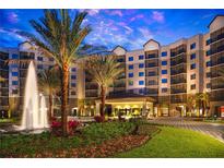 Luxury building exterior with fountain and landscaping at 14501 Grove Resort Ave # 2122, Winter Garden, FL 34787