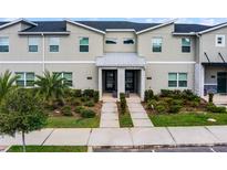 Modern townhome with 2 units and a paved walkway at 4285 Quote St, Kissimmee, FL 34746