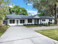 Newly renovated home with a long driveway and modern updates at 245 W George Ave, Maitland, FL 32751