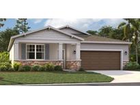 One-story home with a brown garage door and stone accents at 33335 Seattle Slew Dr, Sorrento, FL 32776