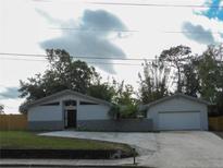 Ranch style home with attached garage and landscaped yard at 1805 North St, Longwood, FL 32750