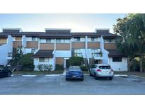 Two-story condo building with parking in front at 4559 Tower Pine Rd # Ge, Orlando, FL 32839