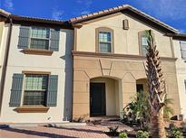 Beautiful two-story home with landscaping at 8811 Geneve Ct, Kissimmee, FL 34747