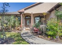 Inviting front entrance with landscaped walkway at 1562 Anorada Blvd, Kissimmee, FL 34744