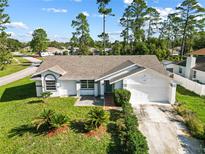 Single-Gathering home with a two-car garage at 2670 Bentley Dr, Deltona, FL 32738